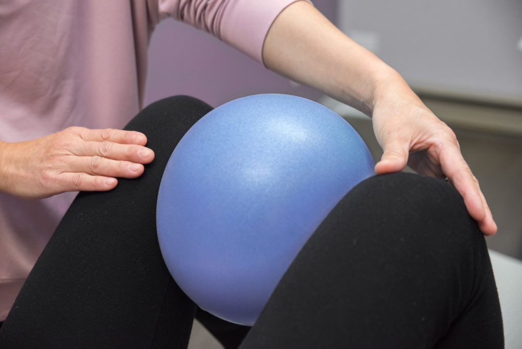 Pelvic Organ Prolapse contact photo. Picture of a physical therapy session using tension balls.